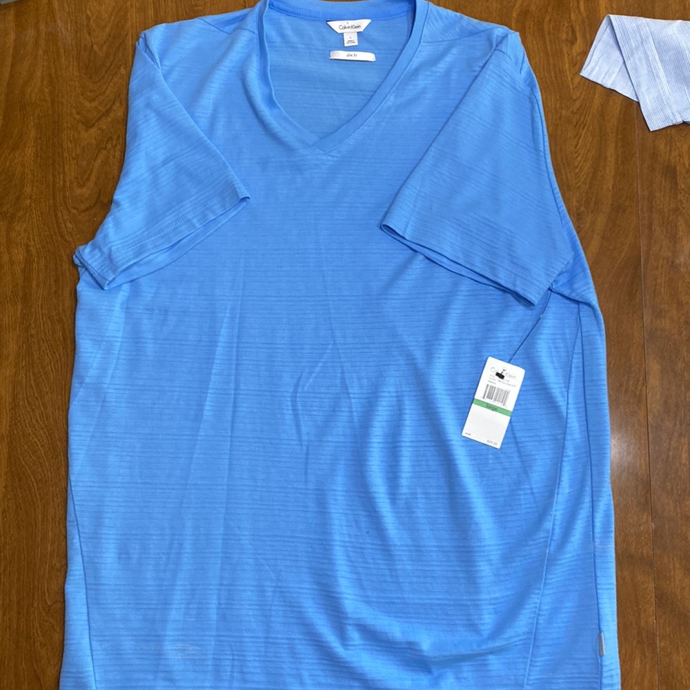 Calvin Klein slim fit baby blue t shirt. Never worn with tags